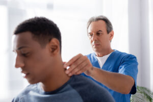 Chiropractor Annapolis, MD- chiropractor working on mans neck