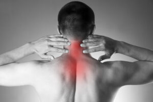 Back Pain Doctor Catonsville, MD with man holding neck in pain